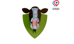 Tête de vache en carton personnalisée avec impression couleur noire et blanche façon vache laitière, support décoratif original et écologique.